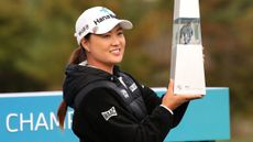 Minjee Lee poses for a photo with the BMW Ladies Championship trophy