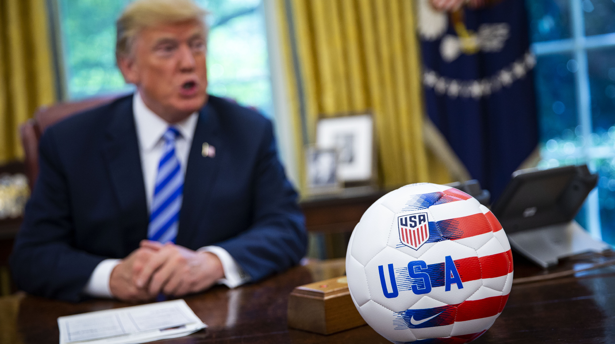 A USA soccer ball is placed on the Resolute Desk as President Donald Trump speaks during a meeting with Gianni Infantino, president of FIFA, not pictured, on Tuesday, Aug. 28, 2018.