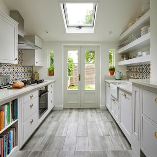 kitchen with white wall and white door