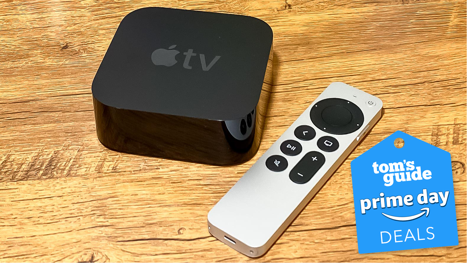 The Apple TV 4K (2021) and the new Siri remote with a Tom's Guide Prime Day image.