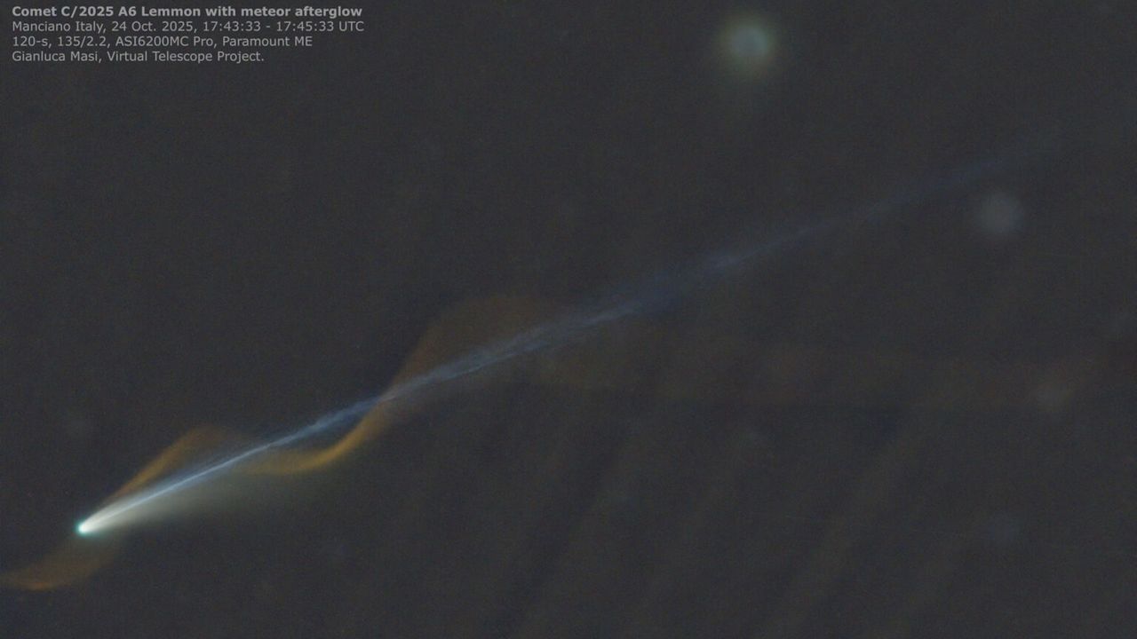 'Miracle' photo captures Comet Lemmon and meteor seemingly entwined over Earth