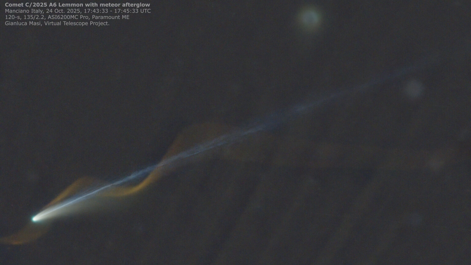 An image of a comet with a straight blue tail and a red meteor corkscrewing around the comet