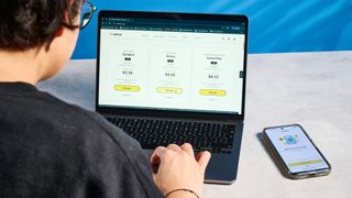 Person using a laptop running Norton 360 antivirus software