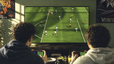 FIFA World Cup: Launch Edition &ndash; two players enjoy Netflix game on a TV (from the trailer)