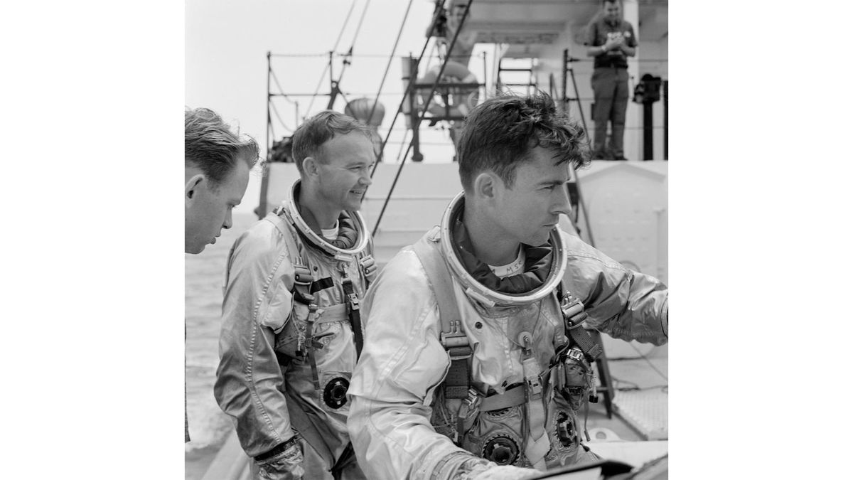 Astronauts Michael Collins (left) and John W. Young (right) on board NASA's Motor Retriever during a water egress training activity.