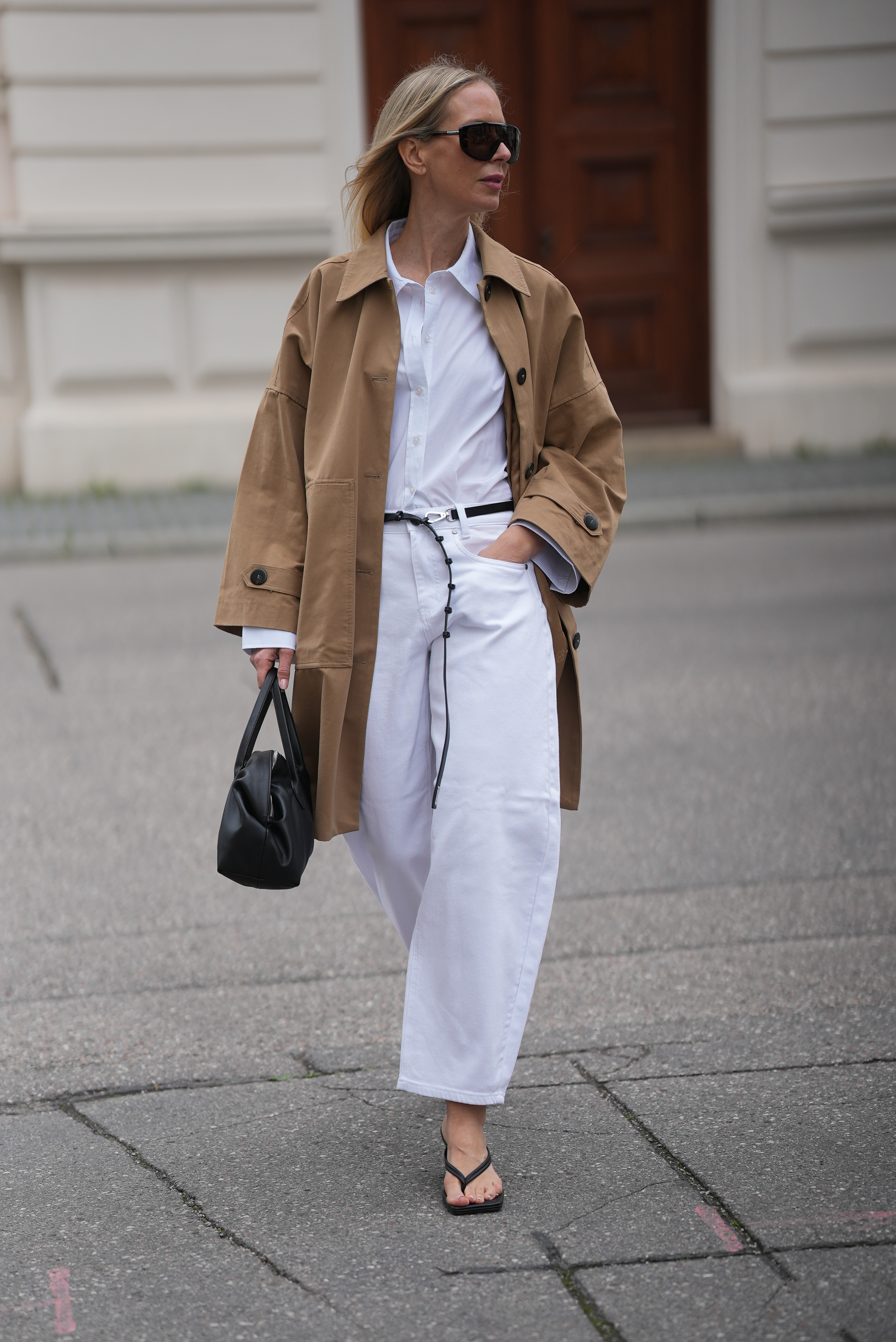 Woman wearing barrel leg jeans.