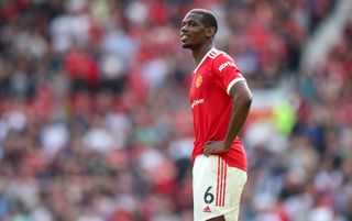 Manchester United midfielder Paul Pogba stands with his hands on his hips