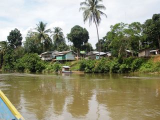 An Indonesian village along a riverbank.