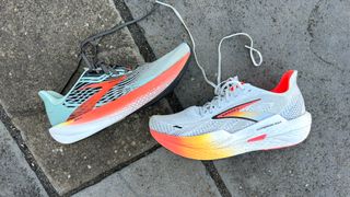 Brooks Hyperion Max 2 running shoes unlaced on a sidewalk