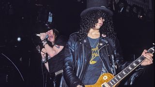 (L) Axl Rose and Slash of Guns N' Roses perform an acoustic set at The Limelight on January 31, 1988 in New York City