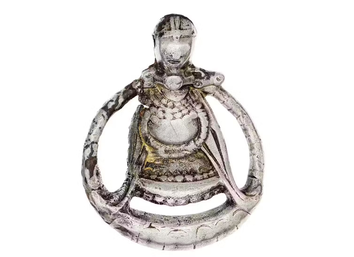 a silver figurine depicting a pregnant woman