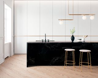Modern kitchen with handleless cabinets in white and black stone island with brass pendant