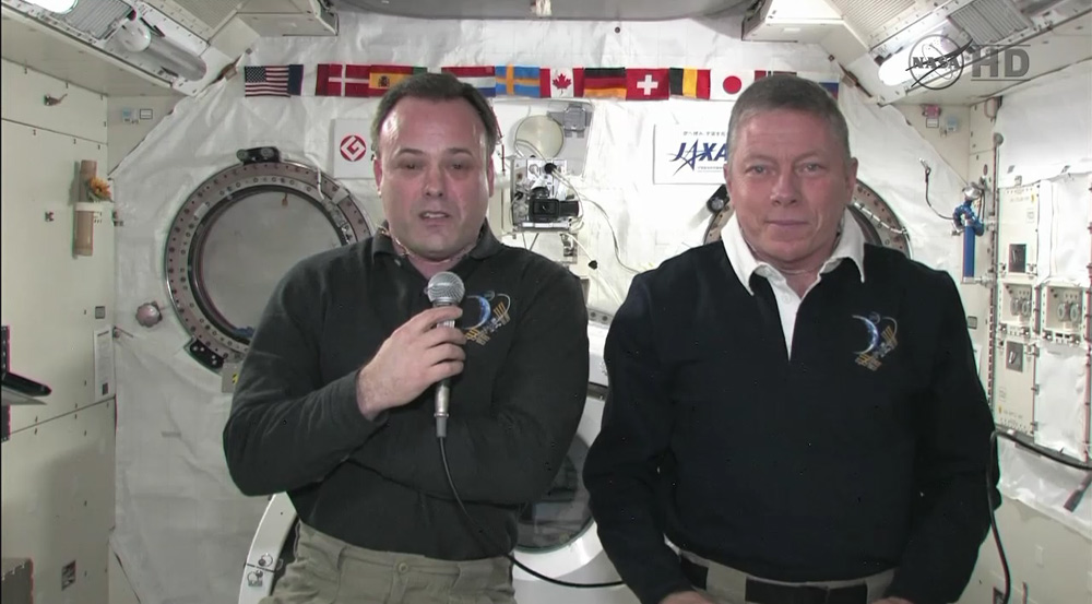 International Space Station astronauts Ron Garan (left) and Mike Fossum talk to reporters Sept. 6.