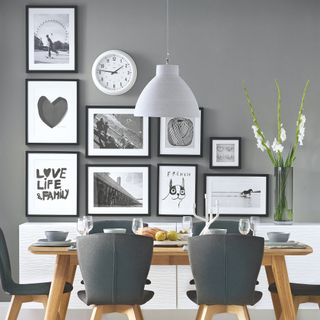 Grey dining room with monochromatic gallery wall