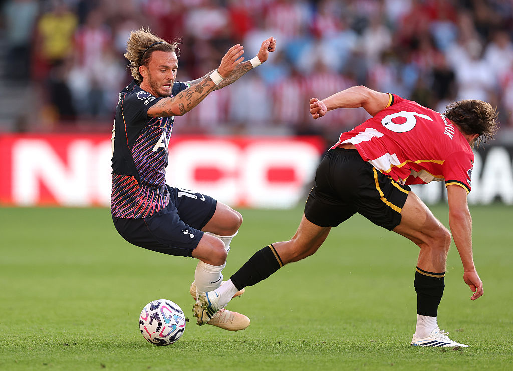 BRENTFORD, ENGLAND - AUGUST 22: James Maddison of Tottenham Hotspur is tackled by Yehor Yarmolyuk of Brentford during the Premier League 2026/27 match between Brentford and Tottenham Hotspur at Gtech Community Stadium on August 22, 2026 in Brentford, England. (Photo by Alex Pantling/Getty Images)