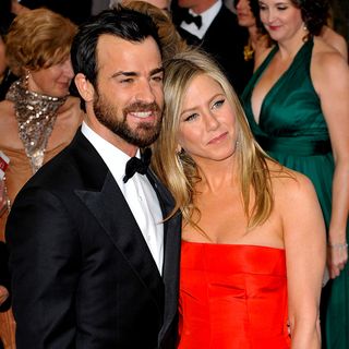 jennifer aniston and justin theroux in red and black dress