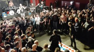 Screengrab of Archspire playing Twister with their fans at a gig