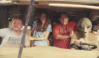 Paul Simon Pegg, Kristen Wiig, and Nick Frost ride in an RV with an alien