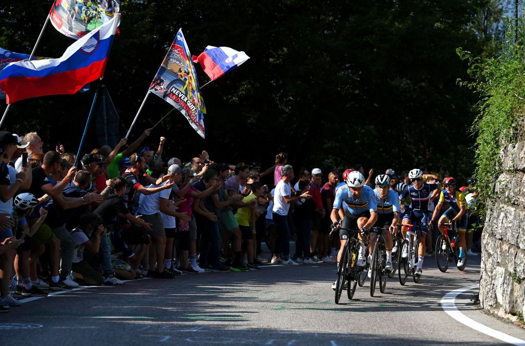 TRENTO ITALY SEPTEMBER 12 Victor Campenaerts of Belgium Remco Evenepoel of Belgium and Benoit Cosnefroy of France lead the peloton while fans cheer during the 27th UEC Road Cycling European Championships 2021 Elite Mens Road Race a 1792km race from TrentoPiazza Duomo to TrentoPiazza Duomo UECcycling on September 12 2021 in Trento Italy Photo by Justin SetterfieldGetty Images