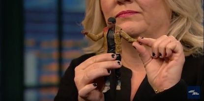 Paula Pell with a Star Wars action figure.