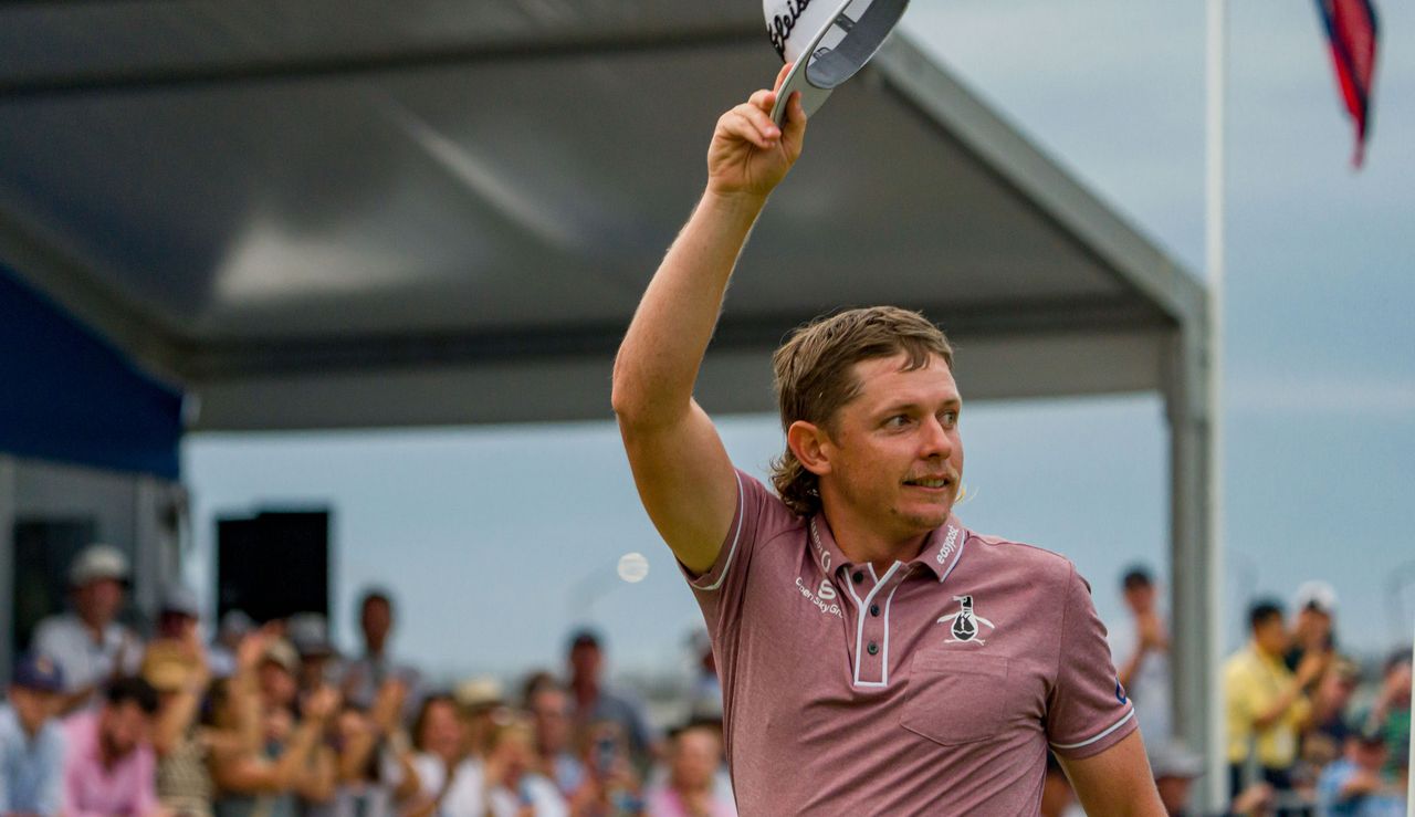 Smith waves to the crowd after his victory