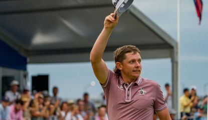 Smith waves to the crowd after his victory