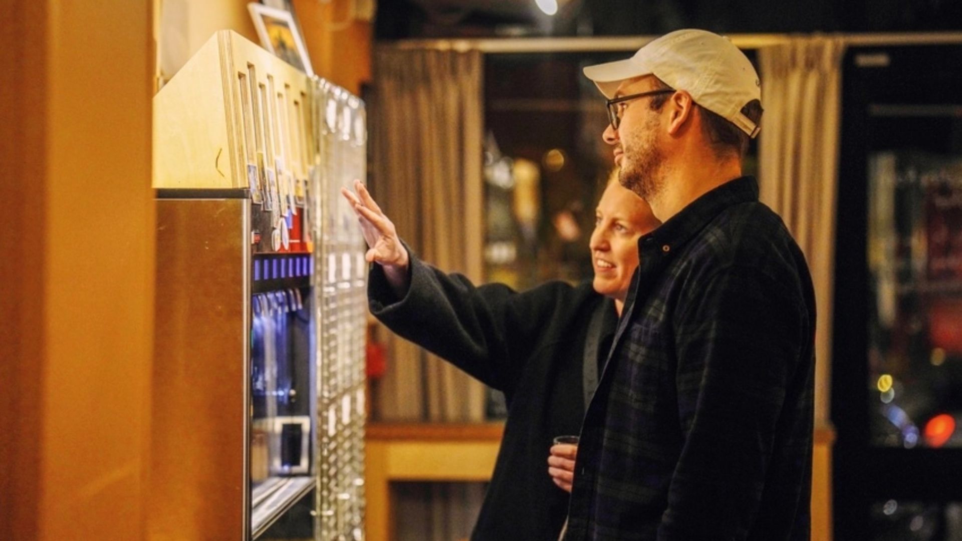 an image of two customers using the self service section of the bar