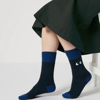 navy and blue socks with embroidered eye design