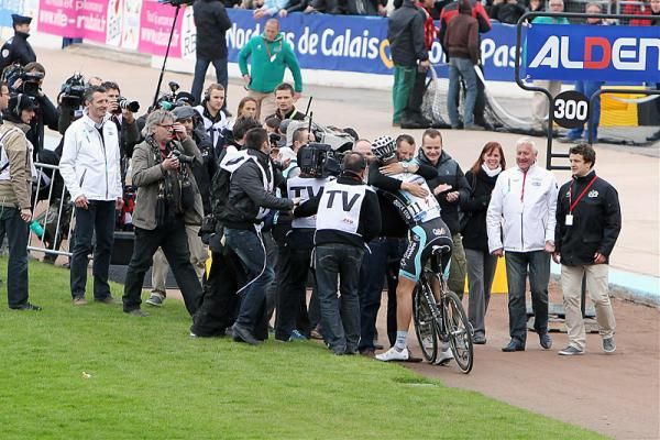2012 Paris-Roubaix champion Tom Boonen is swarmed on the infield of the Roubaix velodrome.