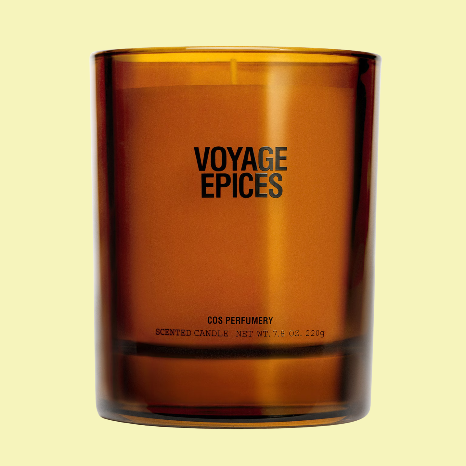 A candle in an amber glass