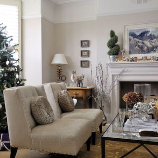 living room with fireplace with table lamp
