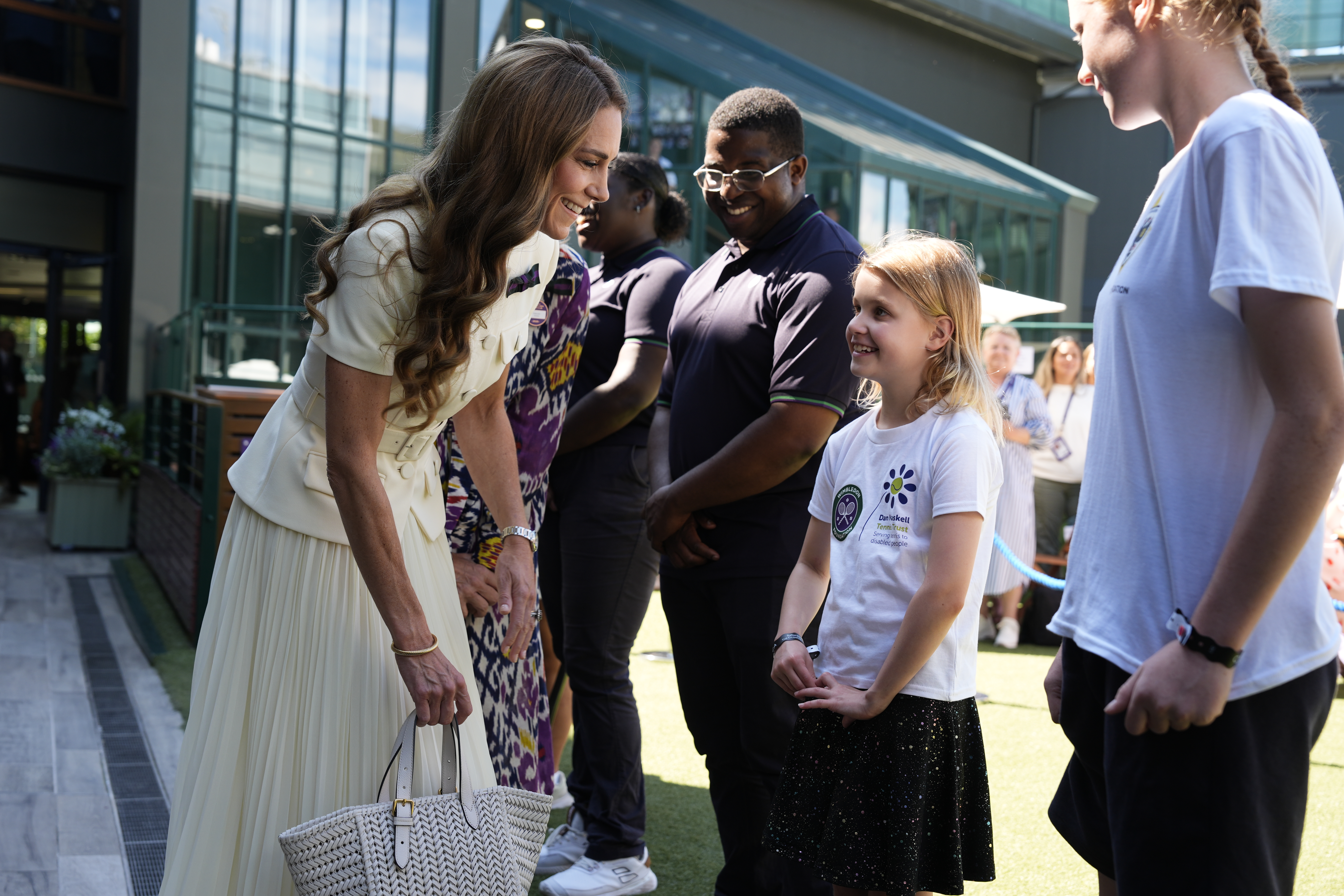 The Princess of Wales meeting 8-year-old Lydia Lowe from the Dan Maskell Tennis Trust at the Ladies' Singles Final during day thirteen of The Championships Wimbledon 2025 at All England Lawn Tennis and Croquet Club on July 12, 2025