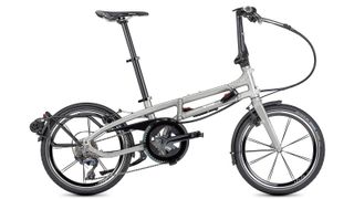 A Tern BYB S11 in silver colour with mudgaurds and kickstand against a white background