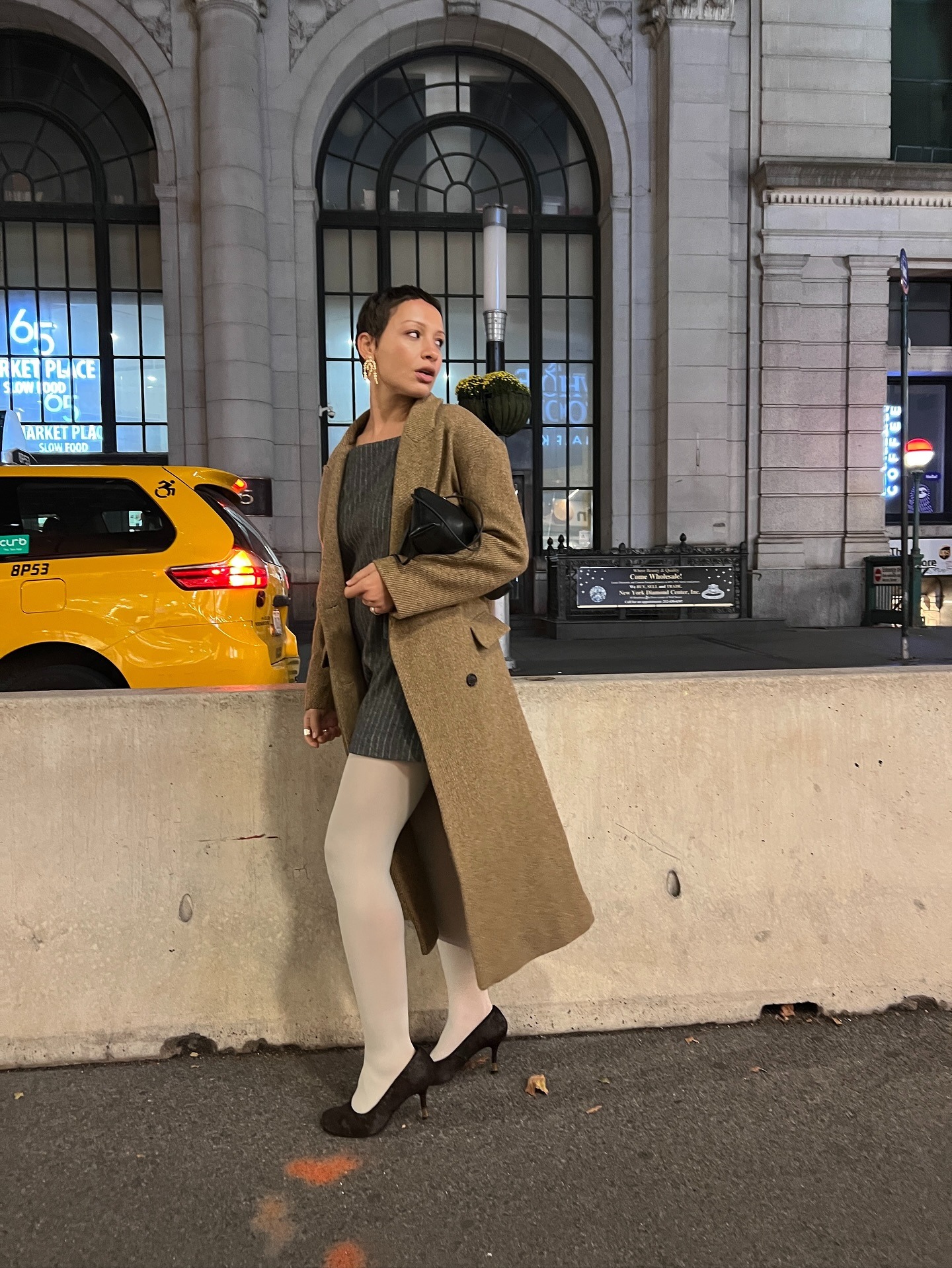 Fashion person Aisha Farida wears a coloured tight outfit. She wears white tights.