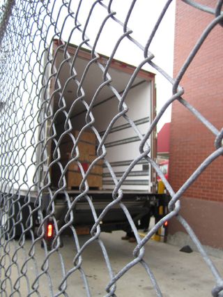 Federal agents loaded crates containing dinosaur bones into a truck on Friday afternoon in Queens, N.Y., when they took possession of the fossils, which are the subject of an ownership dispute.
