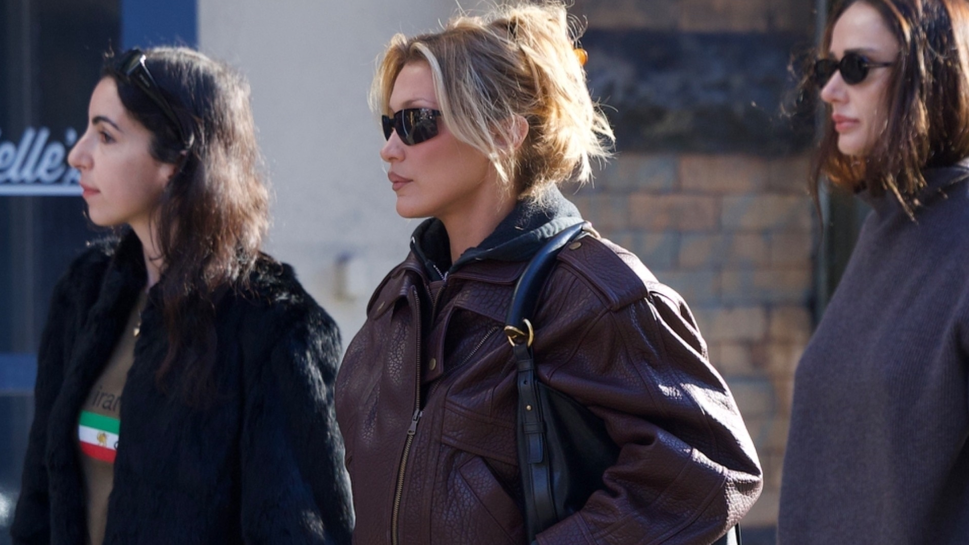 Bella Hadid was spotted in SoHo wearing jeans, a leather bomber jacket, a Saint Laurent bag, and Salomon hiking sneakers