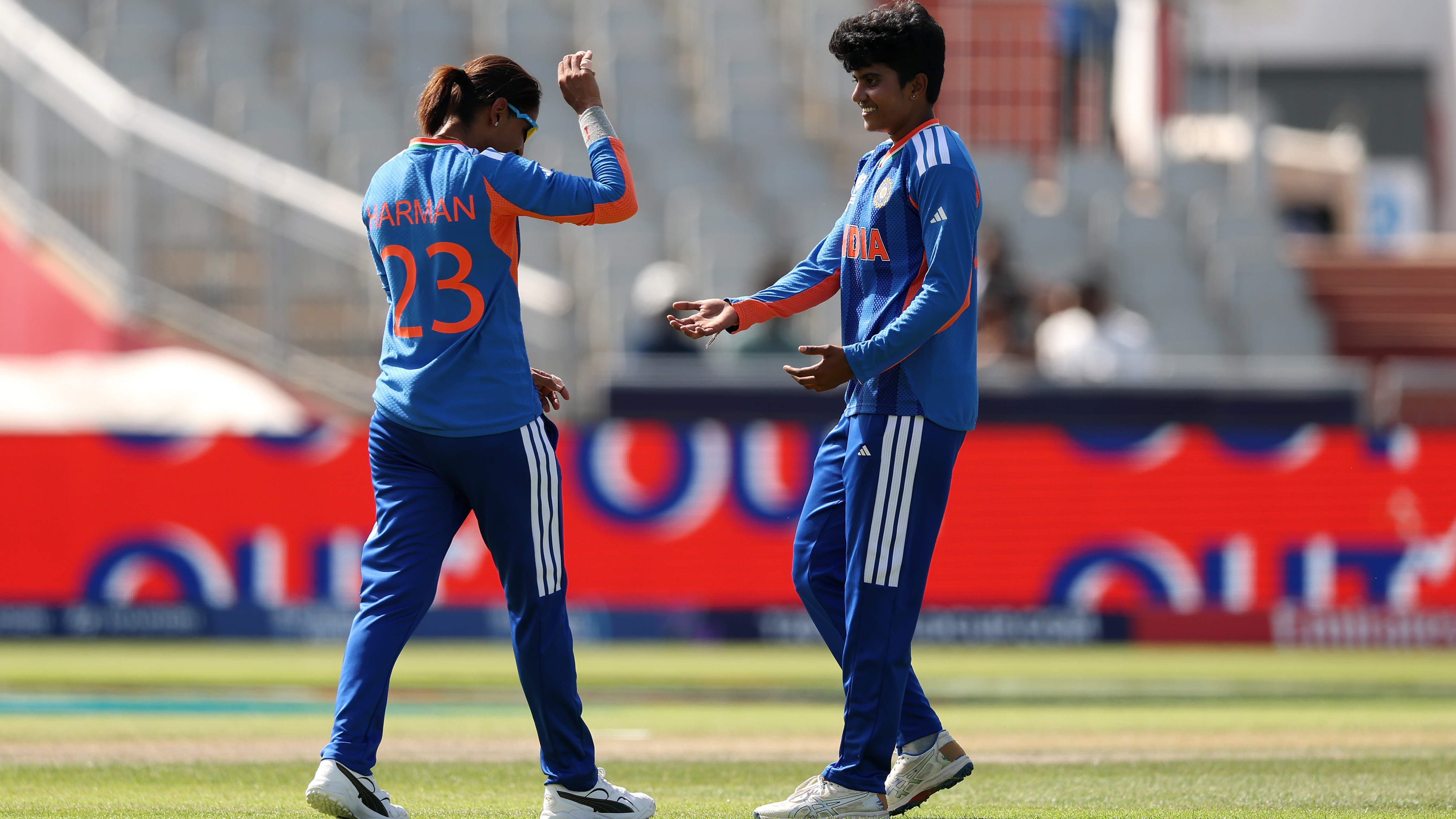 Shree Charani of India celebrates with teammate Harmanpreet Kaur