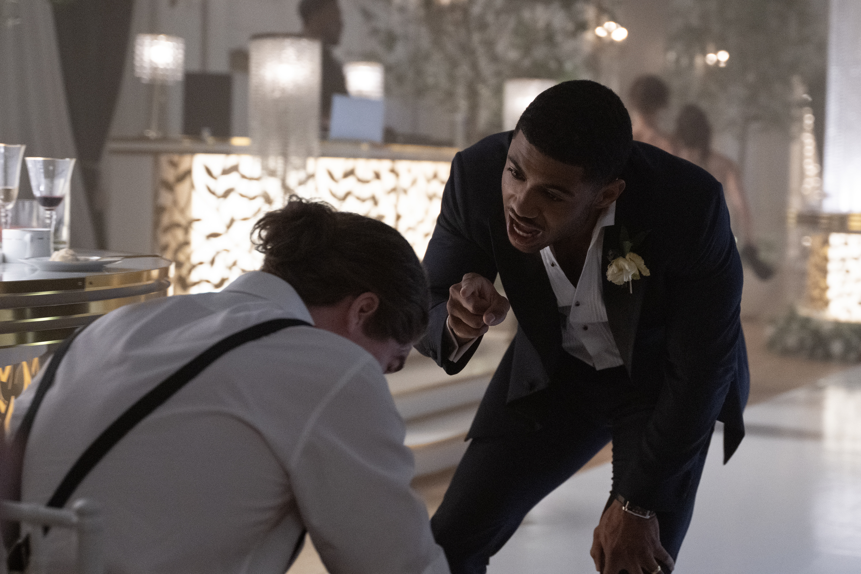 branden cook as evan wearing a suita nd yelling at another man in formal wear on the dance floor of a wedding in tell me lies season 3 finale