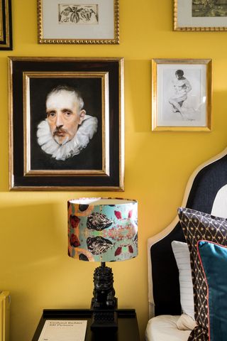 Yellow bedroom with gallery wall