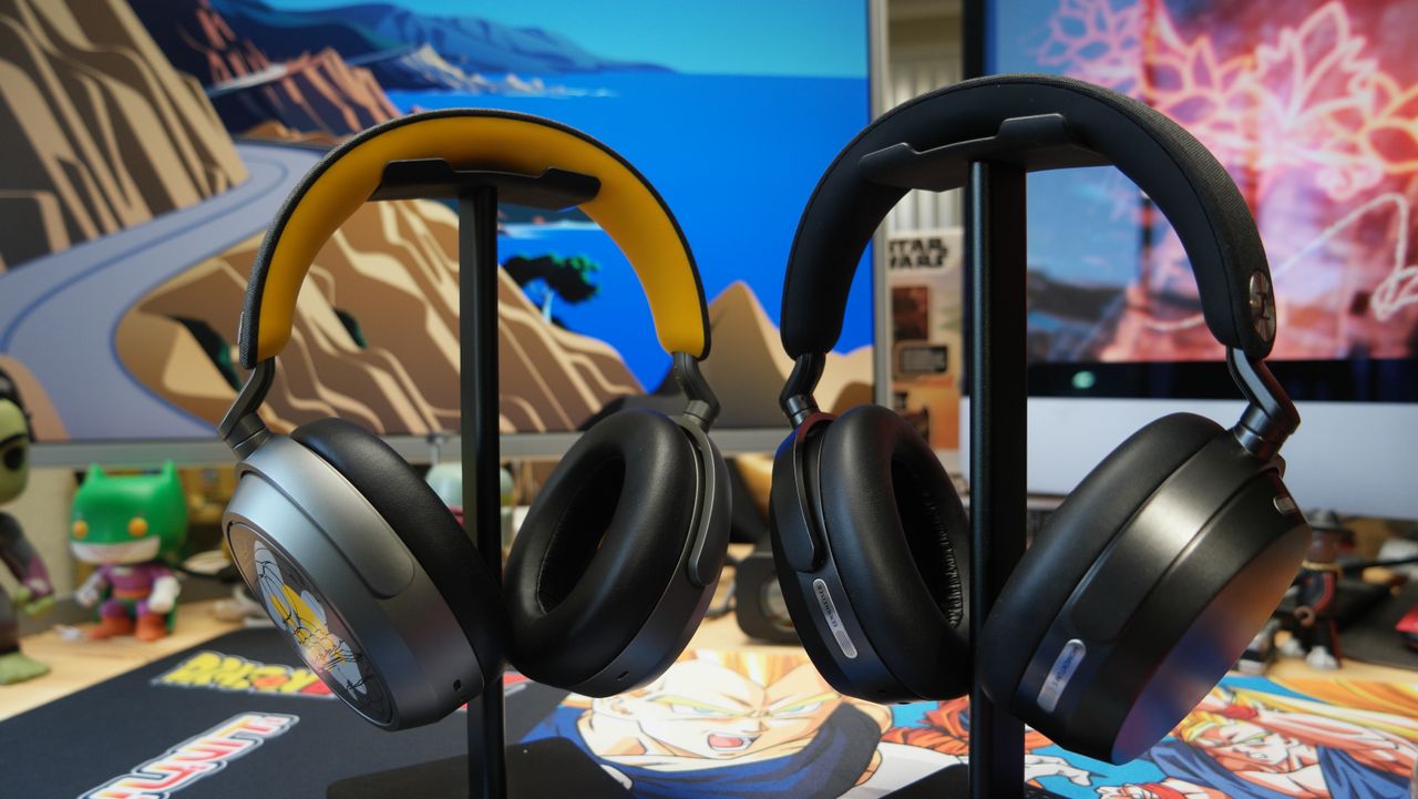 Sennheiser Momentum 5 headphones on a desk next to the Momentum 4 on the left
