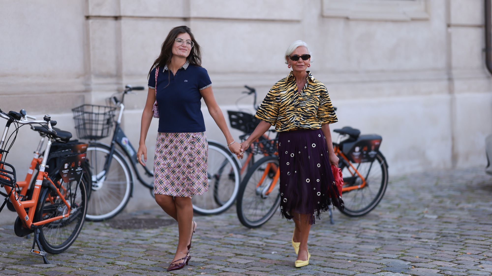 Grece Ghanem and her daughter holding hands
