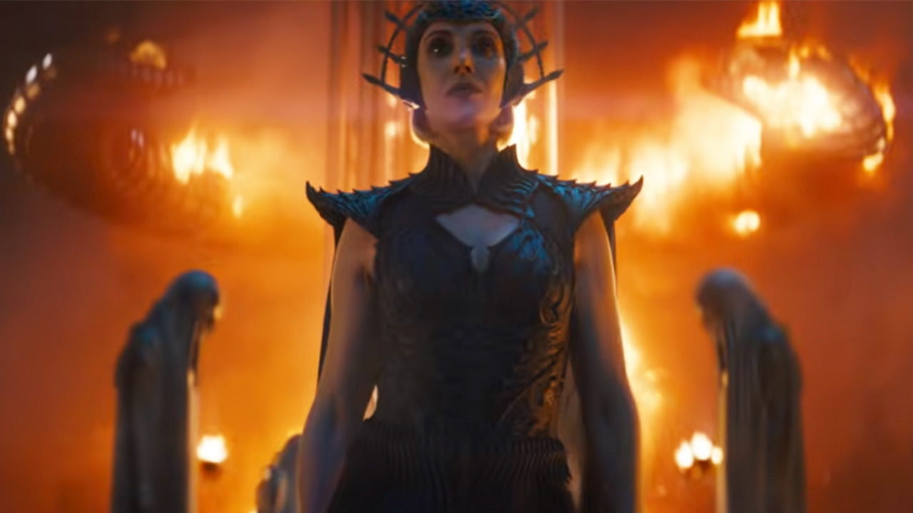 Alison Brie standing in front of flames in Masters of the Universe