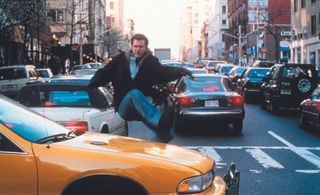 Mel Gibson dashes after the bad guy