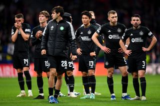 Celtic players look dejected after the team's defeat in the UEFA Champions League match between Atletico Madrid and Celtic FC at Civitas Metropolitano Stadium on November 07, 2023 in Madrid, Spain.