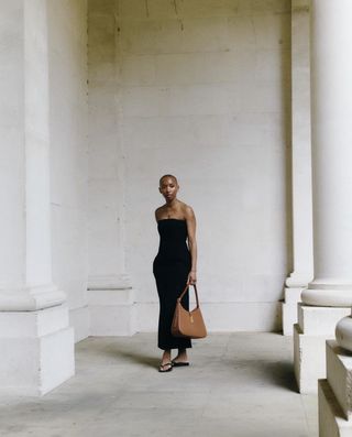 Marisa Martins wears a black bandeau dress