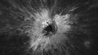 A black and white overhead view of the crater. It really looks like something smashed into it, creating streaks of material flowing outward.