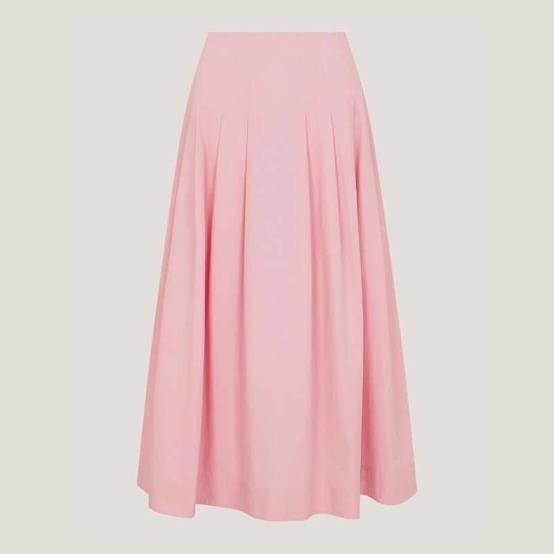 A powder pink maxi skirt against a pale background