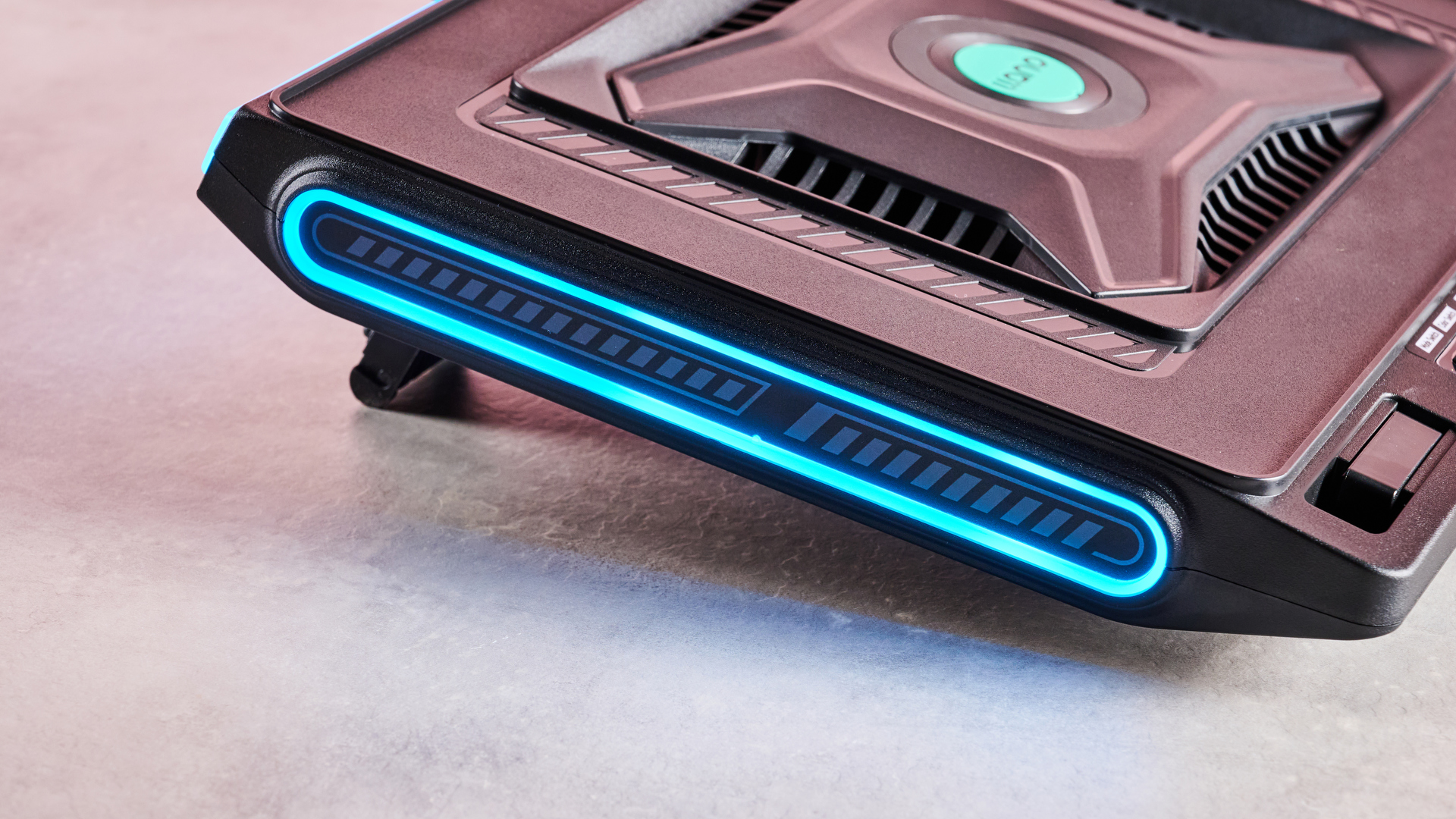 A closeup of the side of the Llano V10 Gaming Laptop Cooling Pad, showing off its RGB lighting.