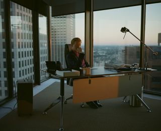 Film still from 'Kinds of Kindness' showing buildings and architecture