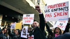 Demonstrators protest against Shein brand's inauguration at the BHV Marais, in front of the BHV in Paris, holding signs saying "proteger les enfants pas shein"